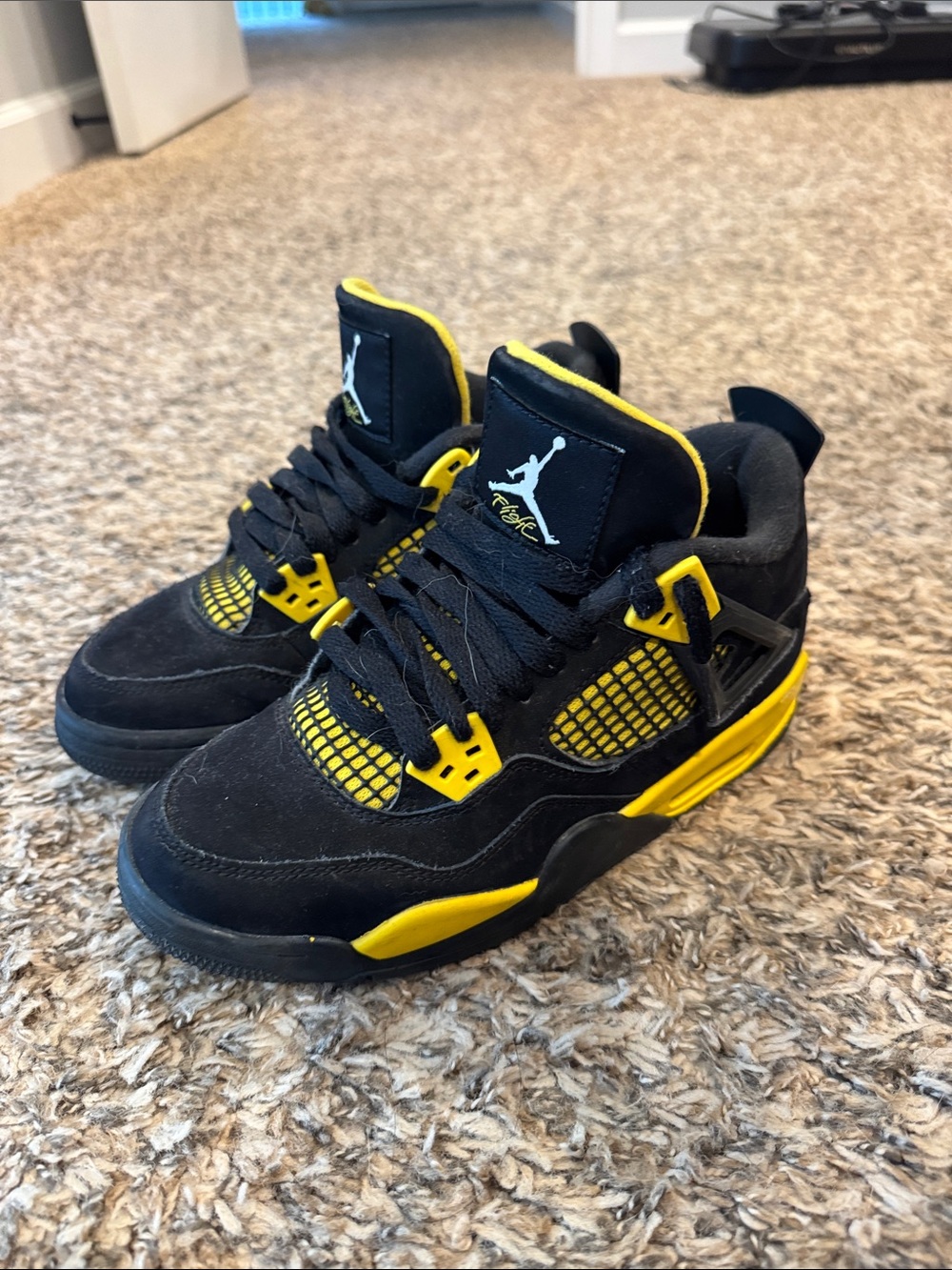 Jordan Black and Yellow Air Jordan 4 Retro Sneakers